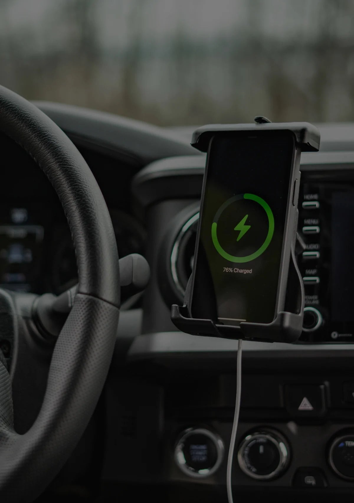 A car dashboard with a phone mount
